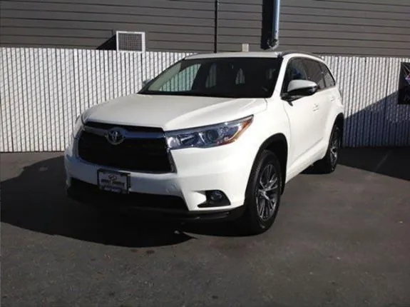 After: front-corner collision repair on a white SUV