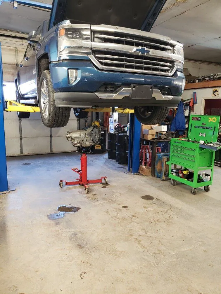 Pickup truck on a lift in the repair bay